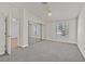 This bedroom has neutral carpet, mirrored closet doors, and a bright window at 2633 S Durango Dr # 204, Las Vegas, NV 89117