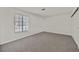 A bright bedroom features neutral carpet, a large window, and a spacious closet at 2633 S Durango Dr # 204, Las Vegas, NV 89117