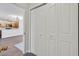 Interior view featuring closet doors in the entryway and partial view into the kitchen and living area beyond at 2633 S Durango Dr # 204, Las Vegas, NV 89117