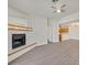 Spacious living room showing the fireplace, new floors, and open access to the kitchen area at 2633 S Durango Dr # 204, Las Vegas, NV 89117