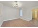 Bright and modern living room with stylish light fixture and entryway at 2633 S Durango Dr # 204, Las Vegas, NV 89117