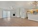 Open concept living area with new floors, updated kitchen, fireplace, and sliding door at 2633 S Durango Dr # 204, Las Vegas, NV 89117