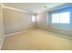 Bright bedroom featuring neutral paint, carpet, crown molding, and natural light from a window at 2694 Rimpacific Cir, Las Vegas, NV 89146