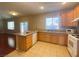 Bright kitchen featuring tile flooring, stainless steel appliances, and eat-in breakfast bar at 2694 Rimpacific Cir, Las Vegas, NV 89146