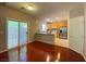 Eat-in kitchen features sliding glass doors, tile flooring, stainless steel appliances, and breakfast bar at 2694 Rimpacific Cir, Las Vegas, NV 89146