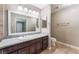 Bathroom featuring granite counters, dark wood vanity, and tile flooring at 2700 N Rainbow Blvd # 1080, Las Vegas, NV 89108