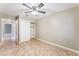 Bedroom featuring tile flooring, a ceiling fan, closet, and neutral paint at 2700 N Rainbow Blvd # 1080, Las Vegas, NV 89108