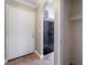 Inviting entryway featuring tile flooring, an arched doorway and coat closet for convenience at 2700 N Rainbow Blvd # 1080, Las Vegas, NV 89108