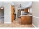 Open concept kitchen with tile flooring, stainless steel appliances, and a breakfast bar at 2700 N Rainbow Blvd # 1080, Las Vegas, NV 89108