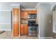 Well-lit kitchen shows matching wood cabinets, stainless steel stove and microwave at 2700 N Rainbow Blvd # 1080, Las Vegas, NV 89108