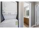Hallway laundry closet with stackable washer and dryer near bathroom at 2700 N Rainbow Blvd # 1080, Las Vegas, NV 89108