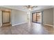 Open living room featuring tile flooring, sliding glass door, and lots of light at 2700 N Rainbow Blvd # 1080, Las Vegas, NV 89108