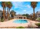 Refreshing community pool surrounded by lush landscaping and palm trees, creating a tropical oasis for residents at 2700 N Rainbow Blvd # 1080, Las Vegas, NV 89108