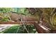 Charming backyard with a swing, lush greenery, and stone accents, creating a serene and inviting outdoor space at 3131 Binaggio Ct, Las Vegas, NV 89141