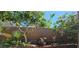 Landscaped backyard with block wall, offering privacy and a serene outdoor space at 3131 Binaggio Ct, Las Vegas, NV 89141