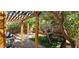 Inviting backyard with pergola, artificial turf, and a swing, creating a peaceful outdoor space at 3131 Binaggio Ct, Las Vegas, NV 89141