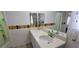 Bathroom features dual sink vanity, neutral countertops, and decor at 3131 Binaggio Ct, Las Vegas, NV 89141