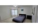 A furnished bedroom with natural light and neutral carpet at 3131 Binaggio Ct, Las Vegas, NV 89141