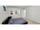 A furnished bedroom with black bed frame and bathroom access at 3131 Binaggio Ct, Las Vegas, NV 89141