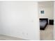 A carpeted bedroom showing a black bed frame with gray bedding and natural light at 3131 Binaggio Ct, Las Vegas, NV 89141