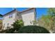 Two-story home showcasing a well-maintained stucco exterior, tiled roof, and manicured landscaping at 3131 Binaggio Ct, Las Vegas, NV 89141