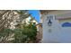 Facade of home featuring house number, security camera, and mature landscaping at 3131 Binaggio Ct, Las Vegas, NV 89141