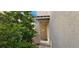 Secured front door entrance framed by lush greenery, offering a private and inviting welcome at 3131 Binaggio Ct, Las Vegas, NV 89141