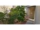 Inviting front entryway with secure screen door and mature landscaping, enhancing curb appeal at 3131 Binaggio Ct, Las Vegas, NV 89141