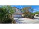 Home exterior showing garage, driveway and front yard landscaping at 3131 Binaggio Ct, Las Vegas, NV 89141