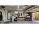 Well-organized garage featuring a water heater, workbench, tools, and storage, offering functionality and convenience at 3131 Binaggio Ct, Las Vegas, NV 89141
