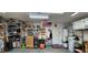 Organized garage with ample shelving, tools, an air compressor, and various equipment, providing storage and workspace at 3131 Binaggio Ct, Las Vegas, NV 89141