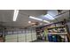 Spacious garage with storage shelves, a bicycle, and a well-lit interior, providing ample space for vehicles and organization at 3131 Binaggio Ct, Las Vegas, NV 89141