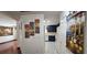 Inviting hallway leading to a modern kitchen with sleek, navy blue cabinets and appliances at 3131 Binaggio Ct, Las Vegas, NV 89141