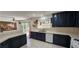 A kitchen featuring dark wood cabinets, white countertops, and modern appliances at 3131 Binaggio Ct, Las Vegas, NV 89141