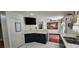 A kitchen area featuring dark wood cabinets, tile floors and appliances at 3131 Binaggio Ct, Las Vegas, NV 89141