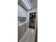 Bright laundry room with white washer, dryer, and upper cabinets at 3131 Binaggio Ct, Las Vegas, NV 89141