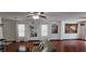 Spacious living room with hardwood floors, ceiling fan and lots of natural light at 3131 Binaggio Ct, Las Vegas, NV 89141
