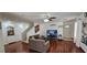 Cozy living room with hardwood floors leading to an open staircase at 3131 Binaggio Ct, Las Vegas, NV 89141
