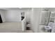 Upstairs loft with stairs to the lower level and adjacent to a full bathroom with shower at 3131 Binaggio Ct, Las Vegas, NV 89141