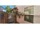 Secure gated side yard featuring a 'Beware of Dog' sign, ensuring safety and privacy at 3131 Binaggio Ct, Las Vegas, NV 89141
