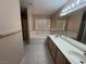 Bathroom with double sinks, large mirror, vanity and tub at 3136 Jane Austin Ave, North Las Vegas, NV 89031