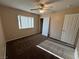 Cozy bedroom featuring neutral tones, a ceiling fan and ample natural light at 3136 Jane Austin Ave, North Las Vegas, NV 89031