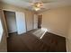 Neutral bedroom featuring a ceiling fan, closet, and doorway to the ensuite bath at 3136 Jane Austin Ave, North Las Vegas, NV 89031