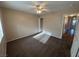 Carpeted bedroom with ceiling fan, closet and ensuite bath at 3136 Jane Austin Ave, North Las Vegas, NV 89031