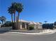 Lovely corner lot home boasts a tile roof, lush landscaping, and a spacious two-car garage at 3136 Jane Austin Ave, North Las Vegas, NV 89031