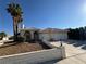 Charming single-story home featuring desert landscaping, palm trees, and a two-car garage at 3136 Jane Austin Ave, North Las Vegas, NV 89031