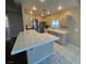 Open-concept kitchen with tile countertops, stainless steel appliances, and ample counter space at 3136 Jane Austin Ave, North Las Vegas, NV 89031
