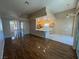Open floor plan featuring living room, breakfast bar, and tiled kitchen at 3136 Jane Austin Ave, North Las Vegas, NV 89031