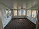 Bright sunroom with multiple windows and ceiling fan at 3136 Jane Austin Ave, North Las Vegas, NV 89031