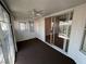 Enclosed sunroom featuring sliding glass doors, textured walls, and a ceiling fan at 3136 Jane Austin Ave, North Las Vegas, NV 89031